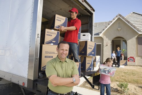 House moving service preparing furniture for transport in Marylebone